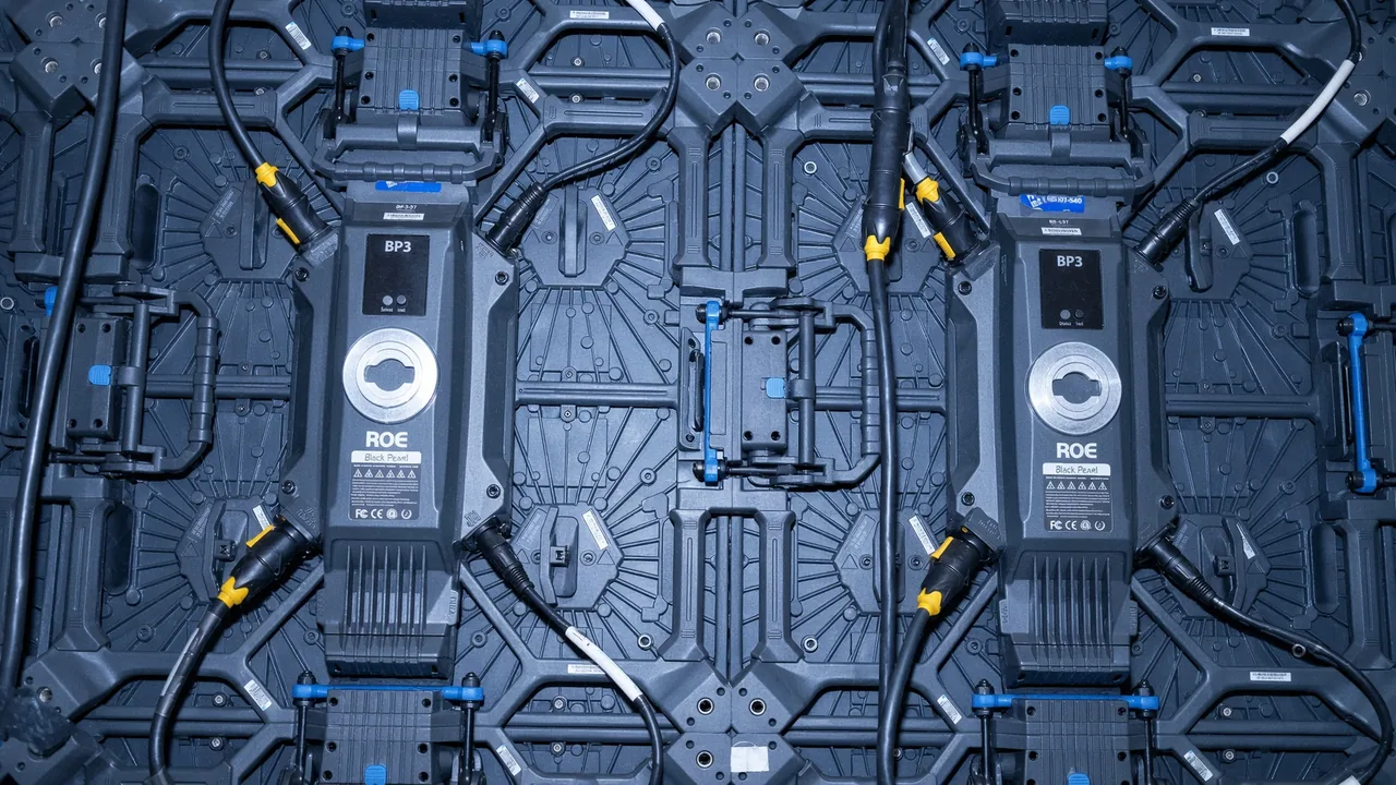 Rear of the LED wall: ROE panels, data and power runs, processors mounted on the frame